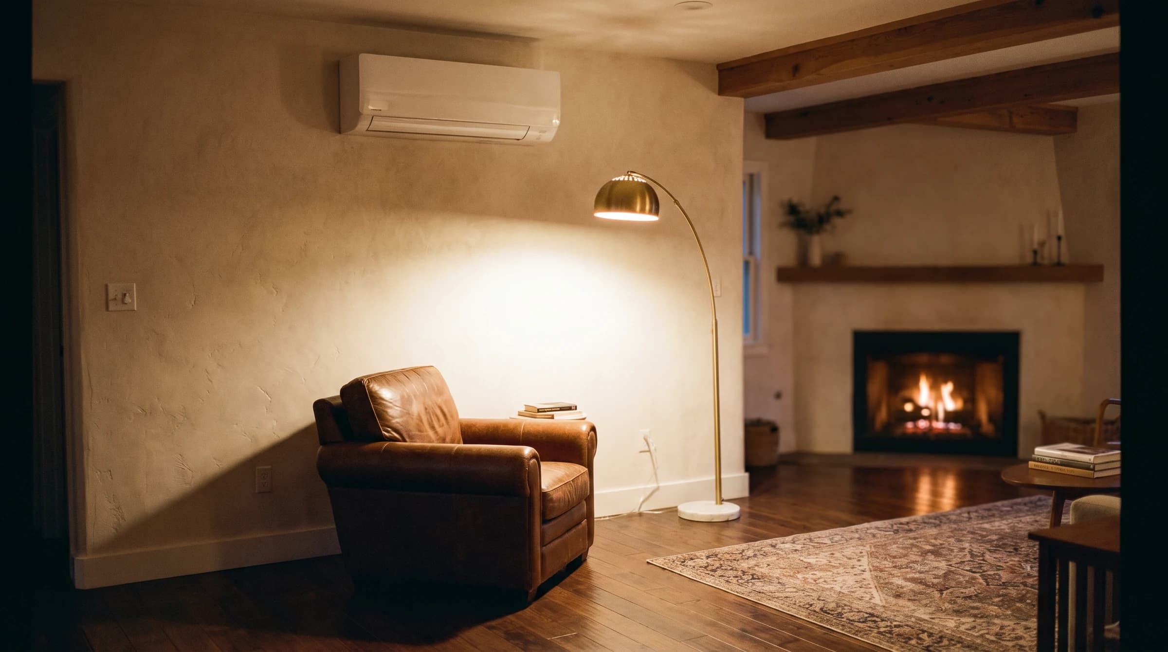 Mitsubishi Smart Multi H2i multi-zone condenser installed against a white clapboard house