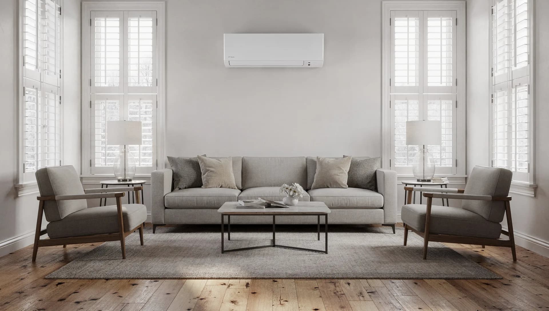 Ductless mini split head mounted high on the wall of a finished room with morning light across the floor